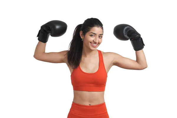 Young Venezuelan woman boxer smiling and looking at camera, isolated. — Stockfoto