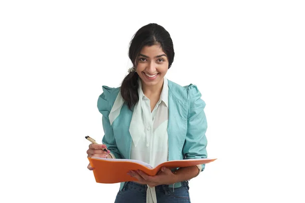 Young Venezuelan businesswoman smiling and looking at camera, isolated. — Stockfoto