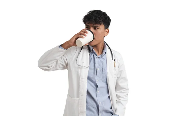 Young Peruvian Male Doctor Drinking Coffee Isolated White Background — Zdjęcie stockowe