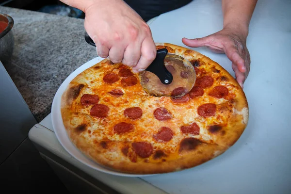 Chef Hands Cutting Freshly Baked Pepperoni Pizza Pizza Cutter Pizzeria — Stock Photo, Image