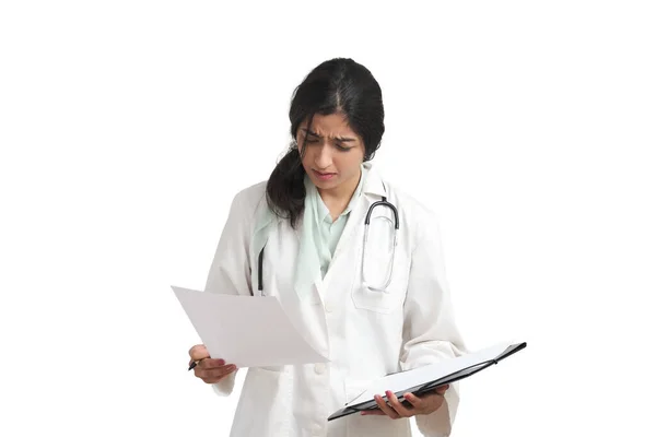 Young Venezuelan Female Doctor Frown Reading Medical Report Isolated White — Fotografia de Stock
