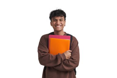 Young peruvian student smiling and holding folders and backpack. Isolated over white background.
