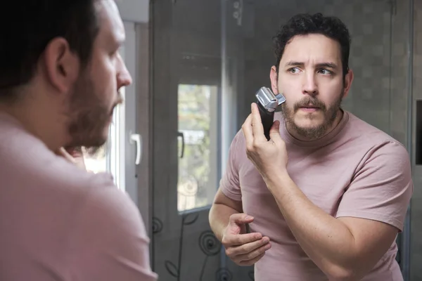 Young Bearded Man Trimming His Beard Electric Shaver Bathroom — Stok Foto