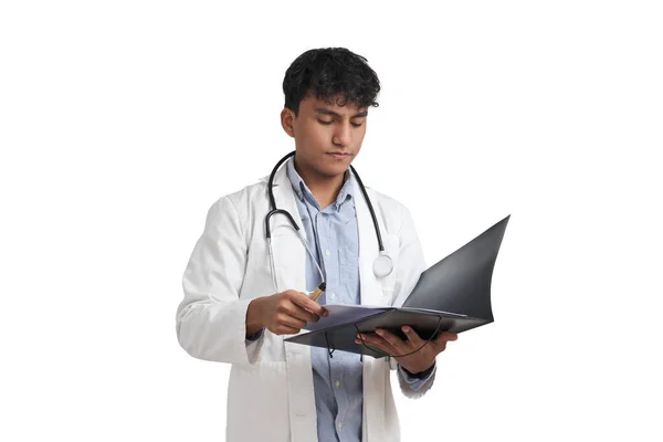 Young Peruvian Male Doctor Reading Medical Report Folder Isolated White — Zdjęcie stockowe