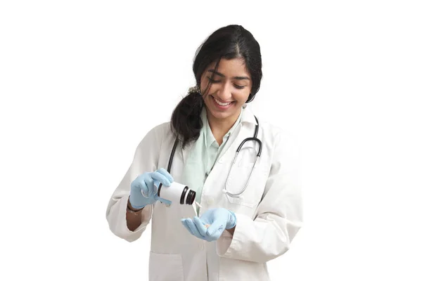 Young Venezuelan Female Doctor Smiling Taking Some Pills Bottle Isolated — 스톡 사진