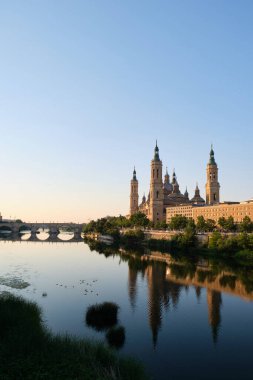 Basilica of Our Lady of the Pillar and Ebro river at sunrise in Zaragoza, Spain. El Pilar de Zaragoza.