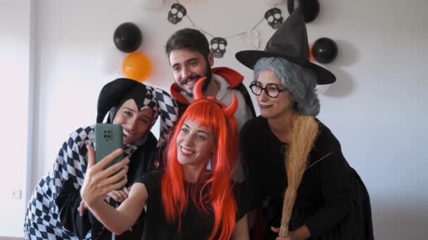 Four People Taking Selfie Photos Funny Faces Costume Halloween Party — Stockvideo