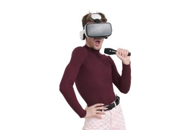 Young caucasian man singing with microphone and virtual reality headset. Isolated over white background.