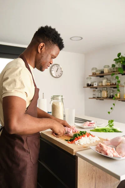 Young African Man Boning Chicken Prepare Recipe Kitchen — Stock Photo, Image