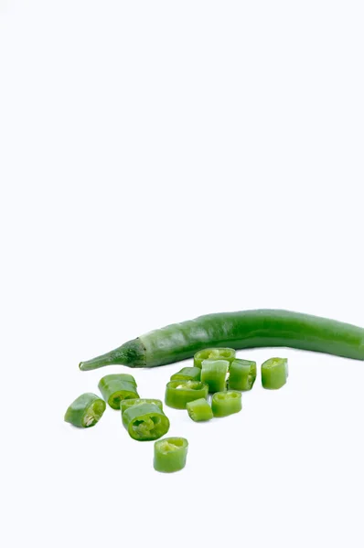 Chopped chillies on white background. side view — Stock Photo, Image