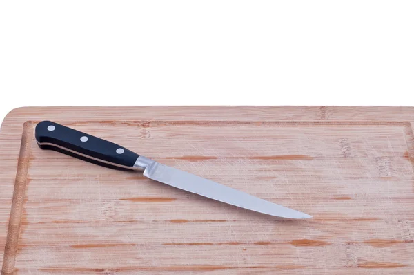 Tabla de cortar con un primer plano cuchillo Fotos de stock