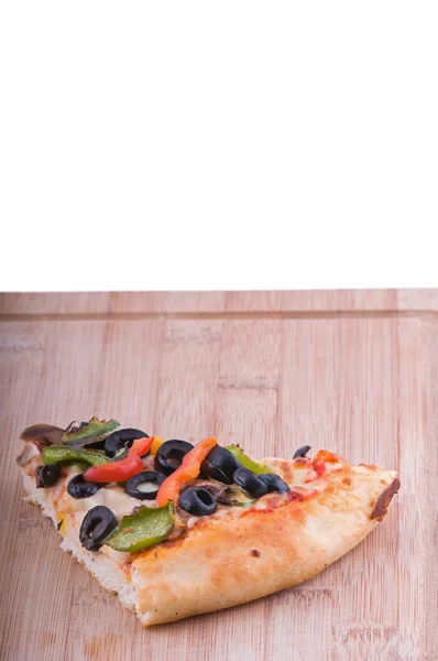 Pizza slice on chopping board vertical — Stock Photo, Image