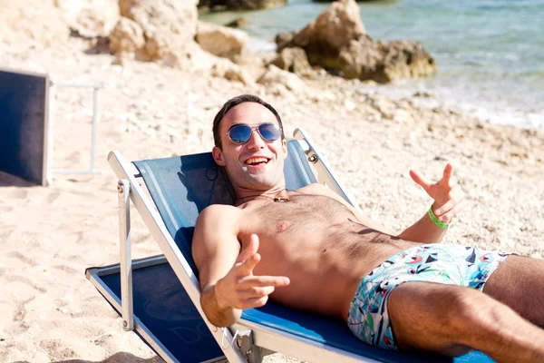 Resting man on a beach