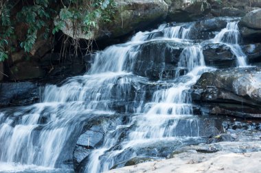 A beautiful deep forest waterfall in Thailand.