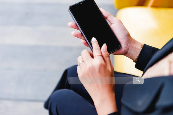 Businesswoman touching mobile phone screen and search page on smartphone touch screen Finding SEO Ideas.