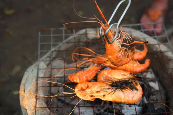 shrimp grilled bbq seafood on stove, outdoor food,  Grilled shrimp on a charcoal stove