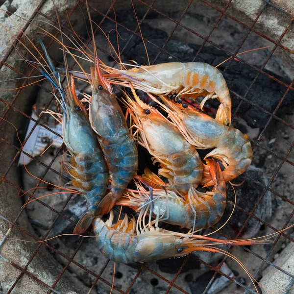 shrimp grilled bbq seafood on stove, outdoor food,  Grilled shrimp on a charcoal stove