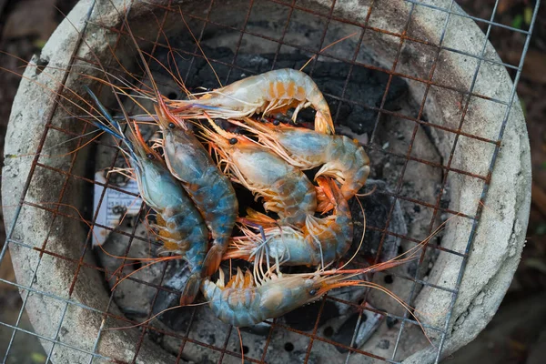 shrimp grilled bbq seafood on stove, outdoor food,  Grilled shrimp on a charcoal stove