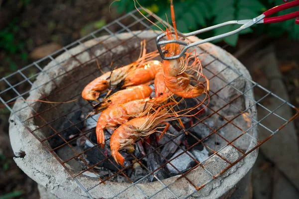 shrimp grilled bbq seafood on stove, outdoor food,  Grilled shrimp on a charcoal stove