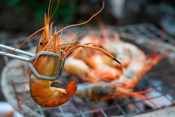 shrimp grilled bbq seafood on stove, outdoor food,  Grilled shrimp on a charcoal stove, close up