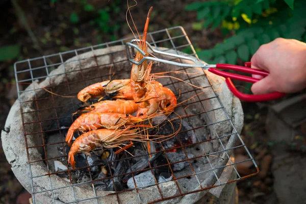 shrimp grilled bbq seafood on stove, outdoor food,  Grilled shrimp on a charcoal stove