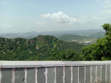 green Aravali mountain and sky  from sajjangarh palace in udaipur city .