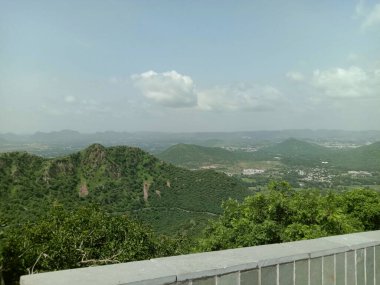 green Aravali mountain and sky from sajjangarh palace  in UDAIPUR CITY RAJASTHAN 