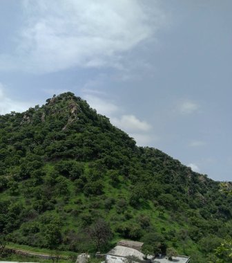 peak view from sajjangarh palace aravali hils and sky in udaipur