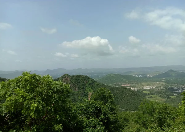 green Aravali mountain and sky  from sajjangarh palace in udaipur city .