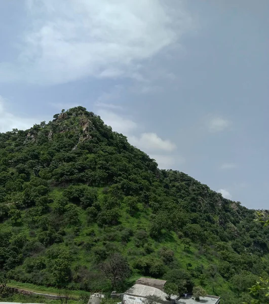 peak view from sajjangarh palace aravali hils and sky in udaipur