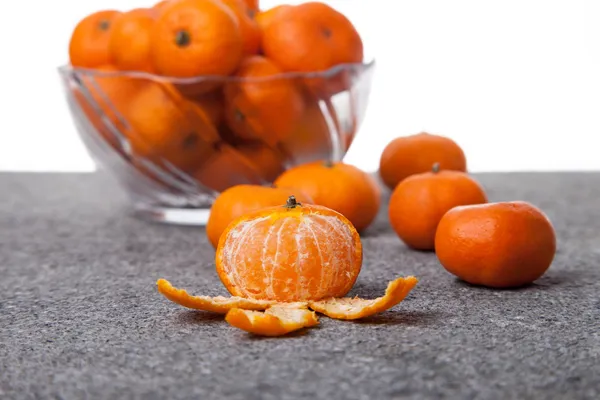 Fresh Clementines fruit peeled with glass bowl — Stock Photo, Image