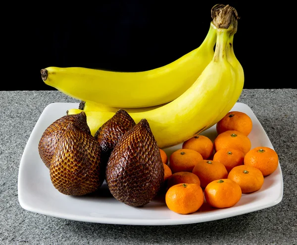 Bananas, Salak and Clementines Fruit in white plate — Stock Photo, Image