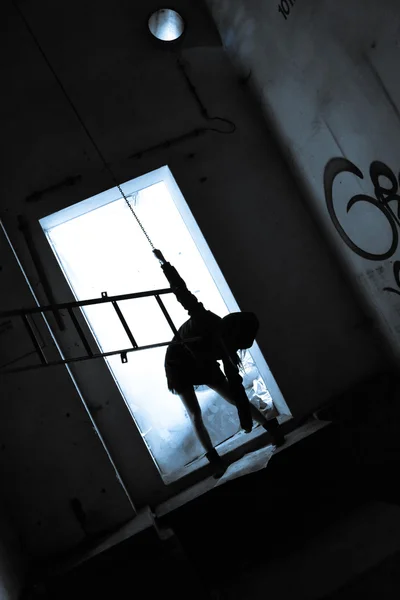 Dramatic image of a girl in an industrial building — Stock Photo, Image