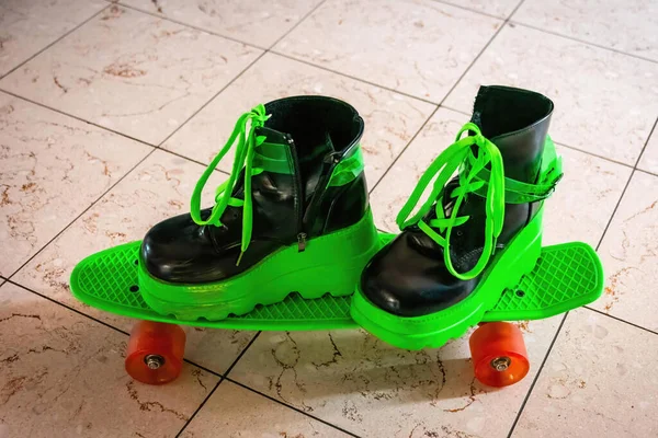 green big shoes on a skateboard