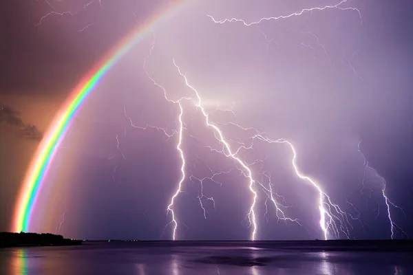 a illustration of lightning storm and rainbow