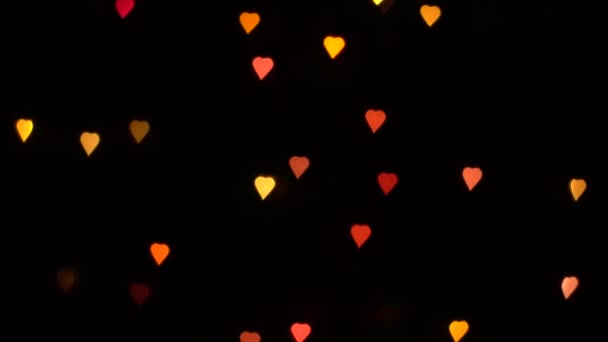 Clignotant Bokeh Lumières Coeurs Sur Guirlande Décorative Sur Fond Noir — Video