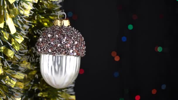 Close Beautiful Christmas Tree Toys Acorn Tinsel Flashing Garland Merry — Stock Video