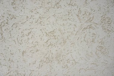 Binanın dışındaki duvarda desenler var. Yakın plan. kaotik desenler. Fotoğraf arkaplanı olarak kullanılabilir