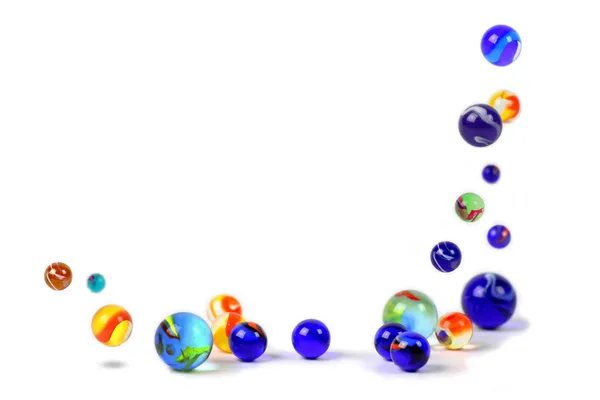 Colorful marbles floating on white background — Stock Photo, Image