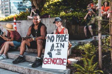 Vancouver, Canada - July ,2022: View of sign No Pride in Genocide as part of protest against celebration of Canada Day in front of Vancouver Art Gallery