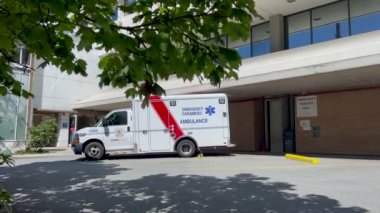 North Vancouver, Canada - July 12,2022: An ambulance in front of Lions Gate Hospital Emergency Department