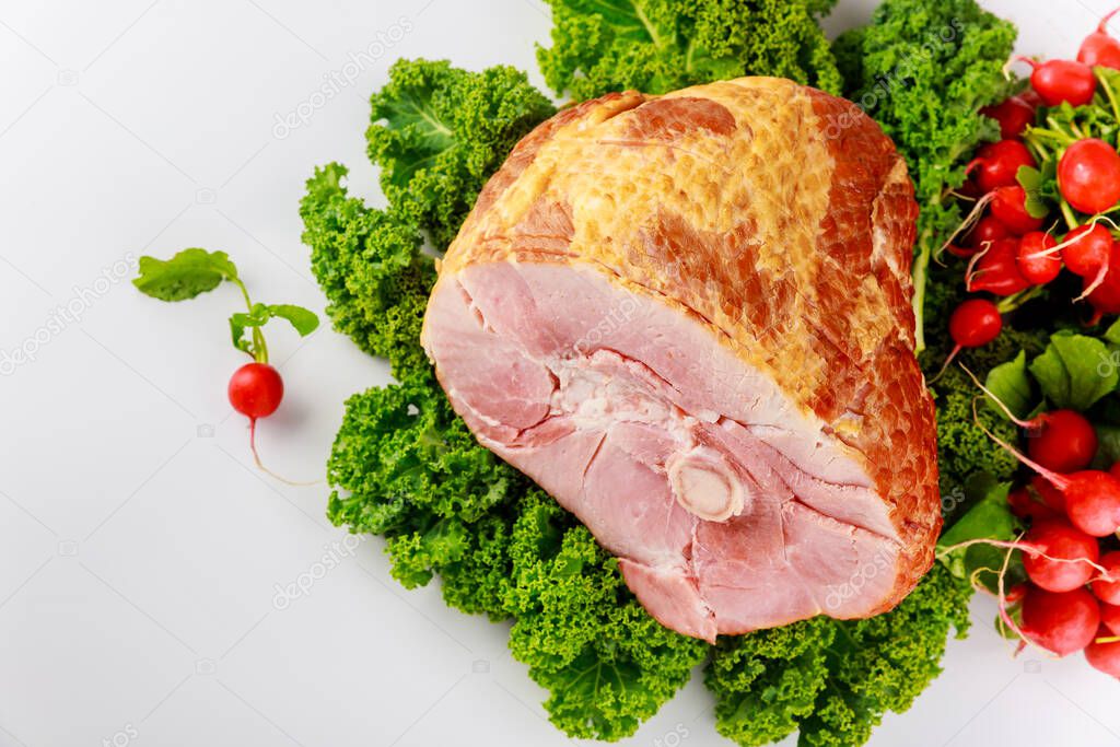 Smoked and presliced pork ham decorated with fresh radish and kale.