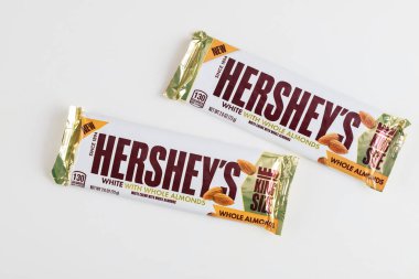 May 4, 2021. New York, US. King size hersheys chocolate bar with whole almonds on isolated white background.