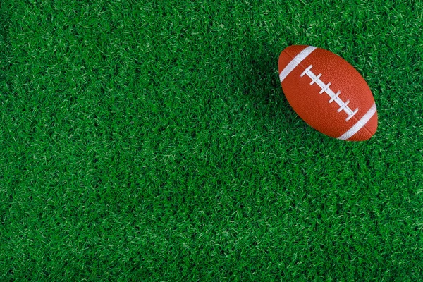 Green Grass Sports Field American Football Ball Football Game Background — Zdjęcie stockowe