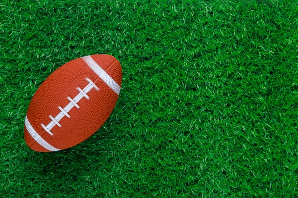 Green Grass Sports Field American Football Ball Football Game Background — стоковое фото