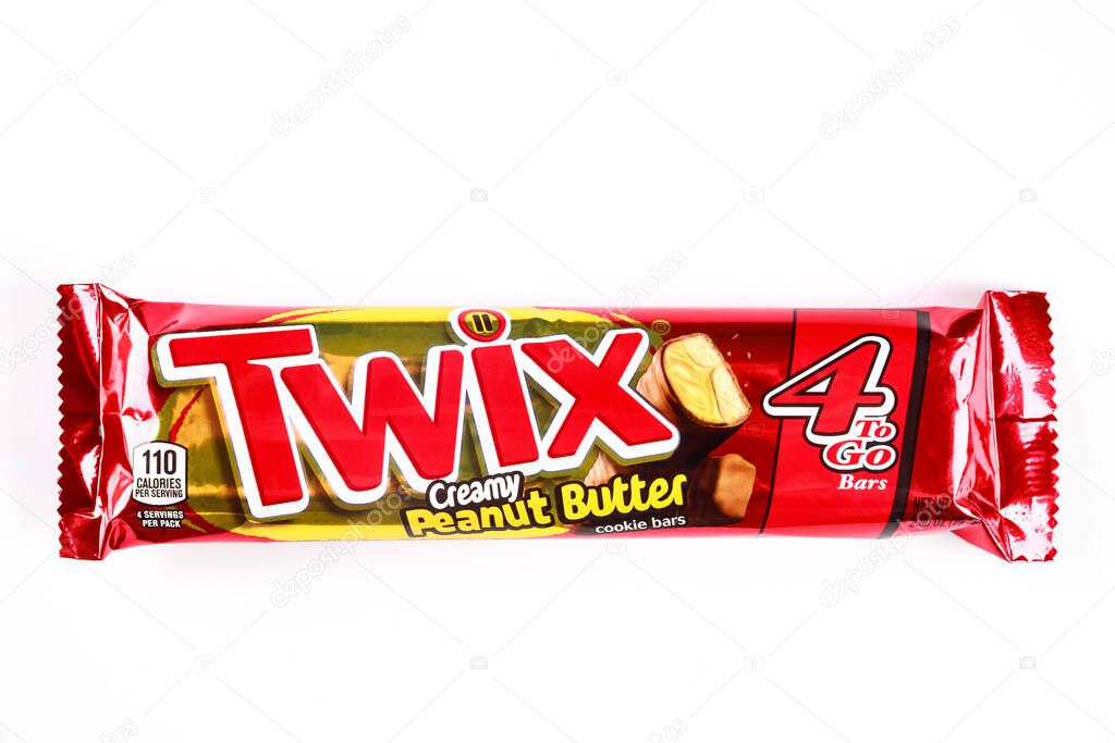 May 4, 2021. New York. Twix cookies coated with milk chocolate isolated on a white background.