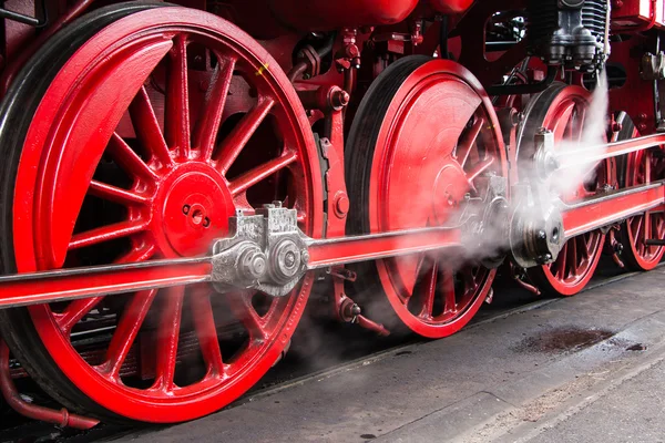 Red wheels of an antique steam locomotive Royalty Free Stock Photos