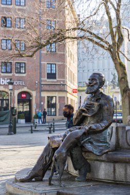 Brussels, Belgium - March 25, 2022: Karel Buls-fountain and sculpture at Agora square in Brussels in Belgium. Old mayor of Brussels
