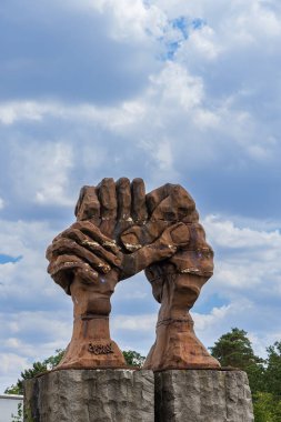 Helmstedt -Marienborn Germany, August 4, 2022: Memorial German division sculpture of two hands in Helmstedt -Marienborn former border crossing of the inner-German border between East and West Germany.
