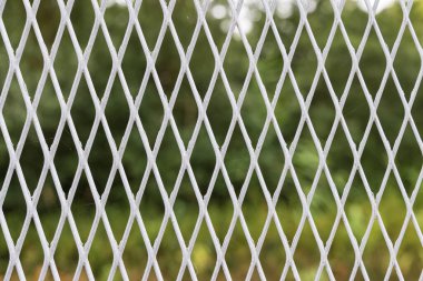 Background with closeup of iron fence or curtain along the former inner-German border during the cold war period in in Germany.